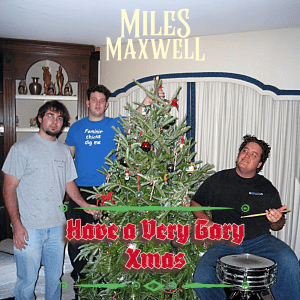 3 men standing by a christmas tree
