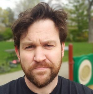 bearded man's face at playground